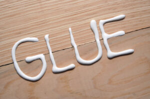 white glue traced as a word on a laminate table